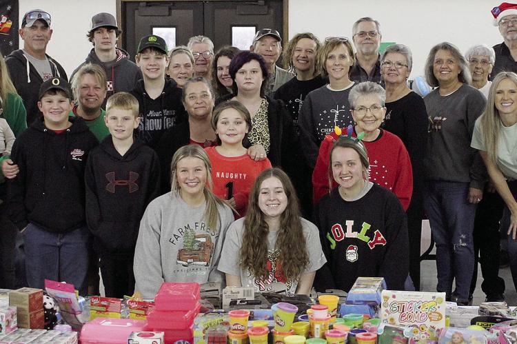 RICHMOND SALVATION ARMY and Rayville Christian Union Church volunteers gather to help families shop for their loved ones this holiday season. SOPHIA BALES | Staff