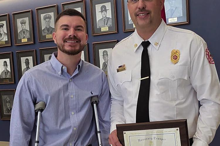 HIGHWAY PATROL CORPORAL Zach Thomas (left) meets Wood Heights Fire Chief T.J. Curry, who was recognized for aiding him at an October crash scene. Submitted