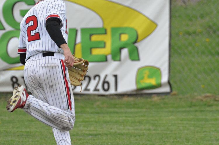 IN ADDITION to providing one of the two hits for Richmond during the Spartans’ loss to Lafayette County of Higginsville, junior Lochlan Steele runs down this ball that’s hit deep into the outfield. SHAWN RONEY | Staff