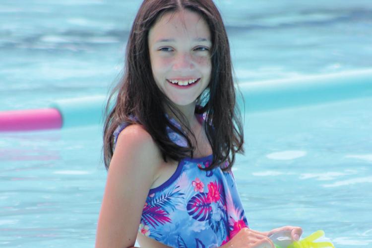RYLEY GALARIADA, 9, plays Wednesday at Richmond’s Southview Pool. She is one of many swimmers enjoying the improvements made to the pool this year by the Parks and Rec Department. SOPHIA BALES | Staff