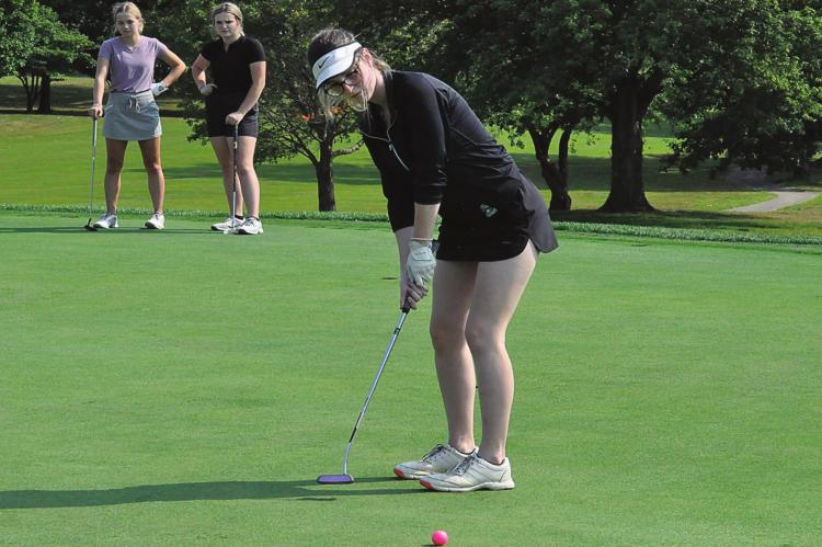 RICHMOND SENIOR attempts a short putt Monday at Shirkey Golf Club during the first day of fall sports practices. SHAWN RONEY | Staff