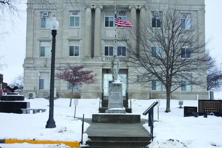 WALKWAYS HAVE been cleared. Snow starts to melt around the courthouse.