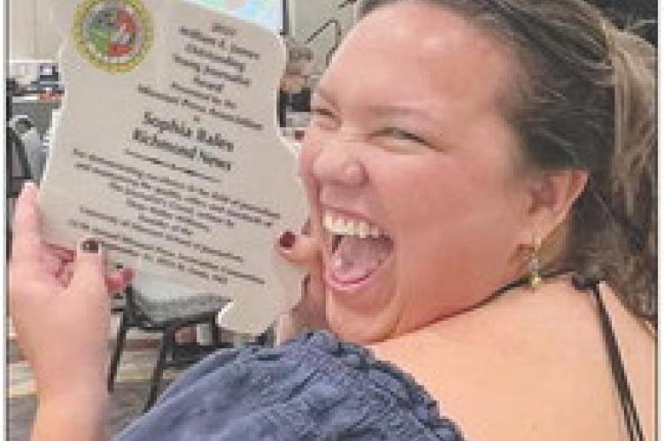 AWARD IN HAND, Sophia Bales shows her excitement. DELVA HUTTO | Staff