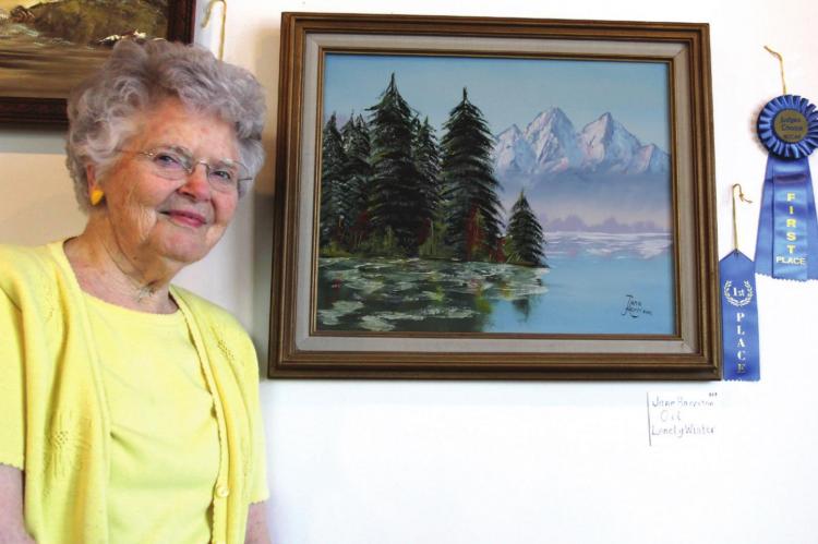 JUNE HARRISON’S landscape painting “Lonely Winter” takes first place as the best oil painting and the Judge’s Choice Award for best overall submission. J.C. VENTIMIGLIA | Staff