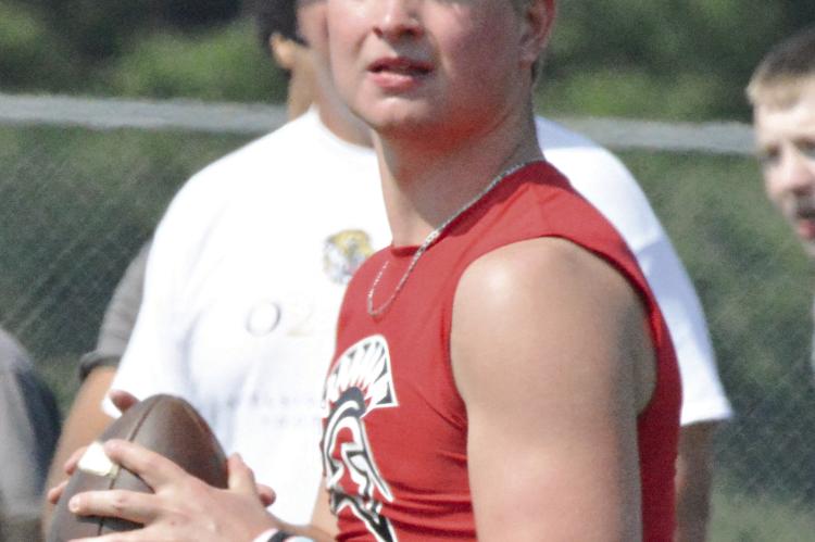 JACOB LIEBERKNECHT looks downfield as he takes reps at quarterback for Richmond. The Spartans concluded a series of Tuesday morning 7-on-7 sessions this week, hosted by Kearney High School. Like Richmond’s other prep sports programs, the football program enters a dead period Saturday.
