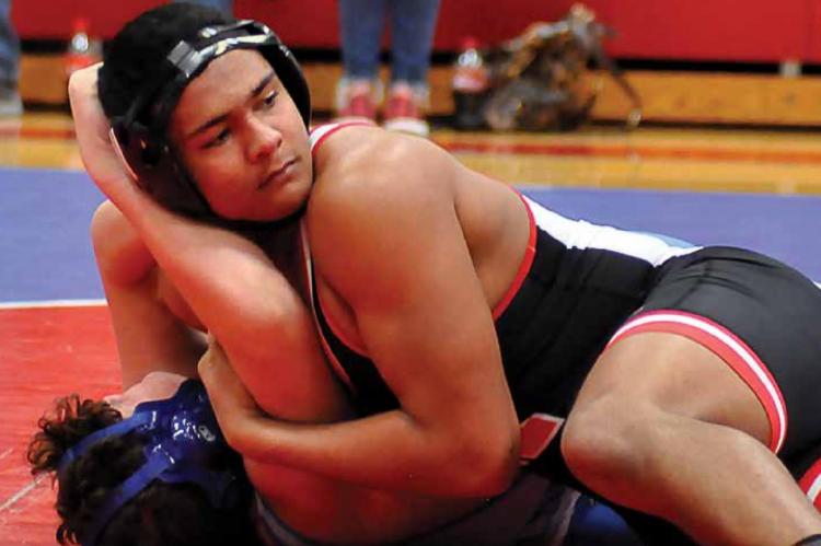 RICHMOND SOPHOMORE Hayden Happy keeps his head up as he maintains control of Brookfield’s Maksim Kerr during the Spartans’ championshp dual Dec. 11 at the Tom Hayes Dual Tournament in Lexington. The Spartans finish second, based on a tiebreaker with Brookfield.