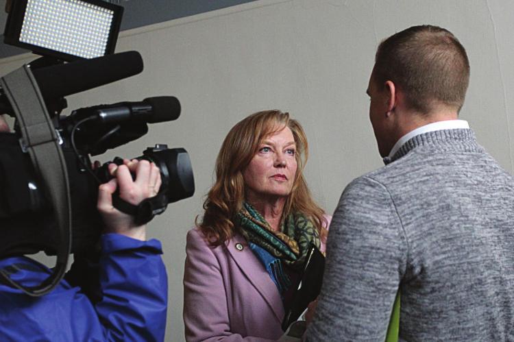 AFTER ANOTHER contentious meeting in February, Ray County Eastern Commissioner Luann Ridgeway answers questions for one reporter, but not others waiting to answer questions in the same hallway in the Clay County Administration Building on the Liberty Square. J.C. VENTIMIGLIA | Staff