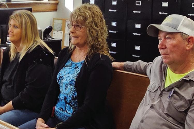 CINDY SHOEMAKER HEWITT (from left), and Roberta and Larry Shoemaker address Ray County Commissioners during public comments, raising concerns about wreck-chasing and requesting an ordinance to address it. MIRANDA JAMISON | Staff
