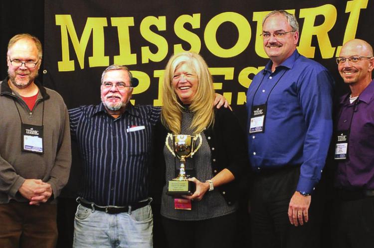 THE 2021 Missouri Press Association Gold Cup Sweepstakes Award goes to the Richmond News for the third year in a row. The award is received Sept. 25 at The Elms Hotel and Spa during the association’s annual three-day convention. From left are Sports Editor Shawn Roney, Editor-in-Chief Jack “Miles” Ventimiglia, association President Liz Irwin, Publisher Brian Rice and sportswriter Dustin Danner. PATRICIA M. VENTIMIGLIA