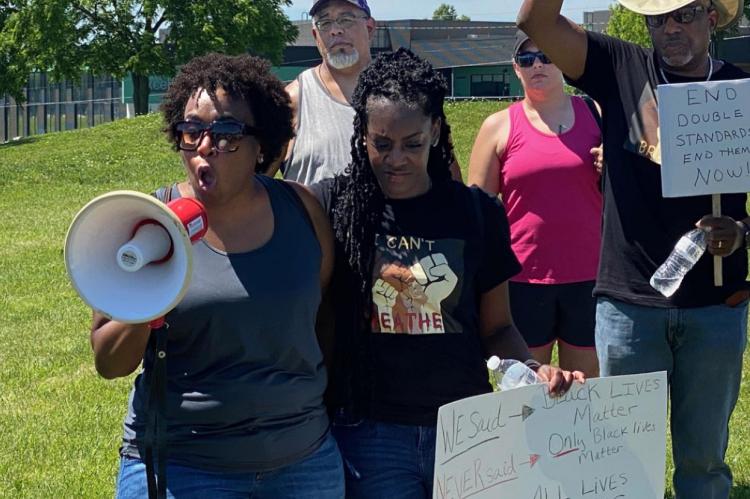 KATINA GILL appeals for an end to divisions caused by race. BRIAN RICE | Staff