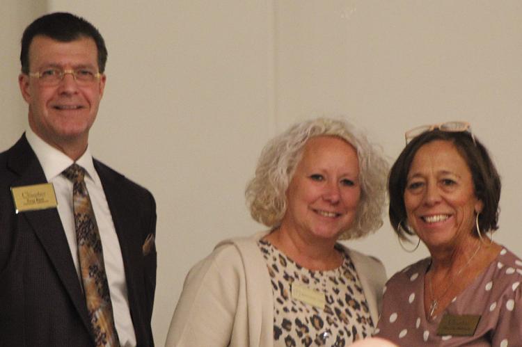 BECKY FRANKLIN (center), Shirkey Hospice “What If” program coordinator, accepts the award for Outstanding Service from Outgoing Chamber President Troy Rust (left) and Incoming Chamber President Christal Milligan. SHARON DONAT | Staff