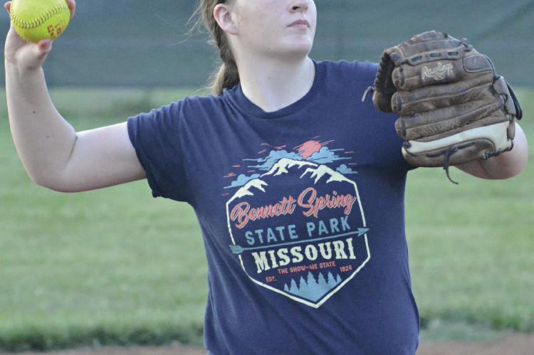 LILLY LYON rears back to throw home from third base.