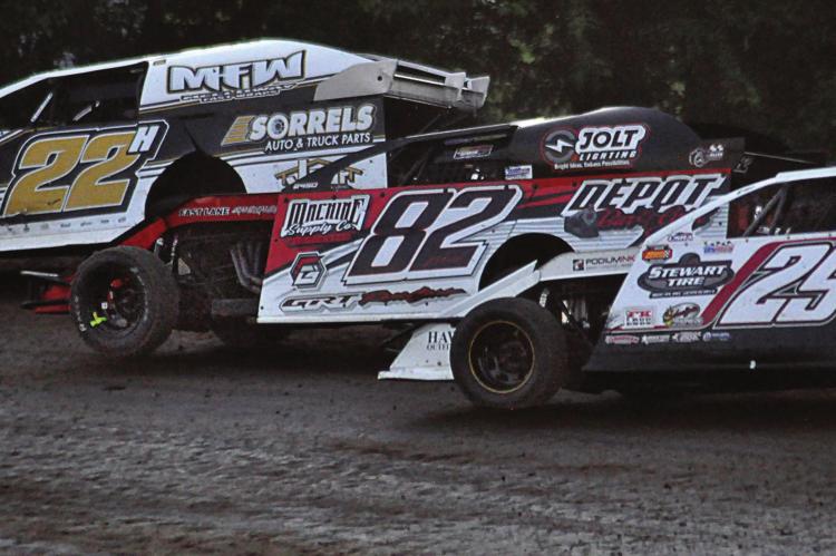 DRIVING THE 82 car, Richmond’s David Wood leans into a turn during his heat race June 12 at Central Missouri Speedway. SHAWN RONEY | Staff