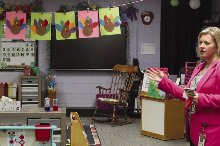 DEAR ELEMENTARY Principal Dr. Sarah Boyd shows off the childrens’ Thanksgiving artwork. SHARON DONAT | Staff