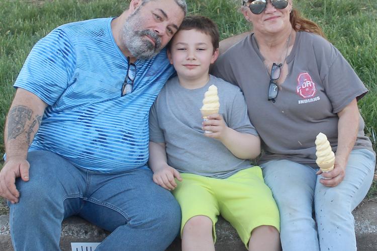RANDY BOUDD (LEFT) WITH HIS son, Kash, and wife, Karry, take a break from the festivities to enjoy ice cream cones. MIRANDA JAMISON | Staff
