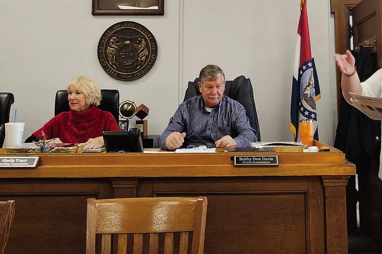 COMMISSIONERS MAX HOCKEMEIER (from left), Shelia Tracy and Bobby Don Davis review materials as MU Extension Engagement Specialist Chelsea Corkins presents budget and program information. MIRANDA JAMISON | Staff