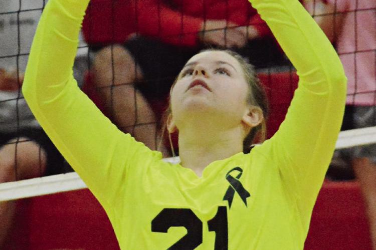 SENIOR ALLISON COATS practices her setting before Richmond’s Oct. 12 varsity match with visiting Carrollton.