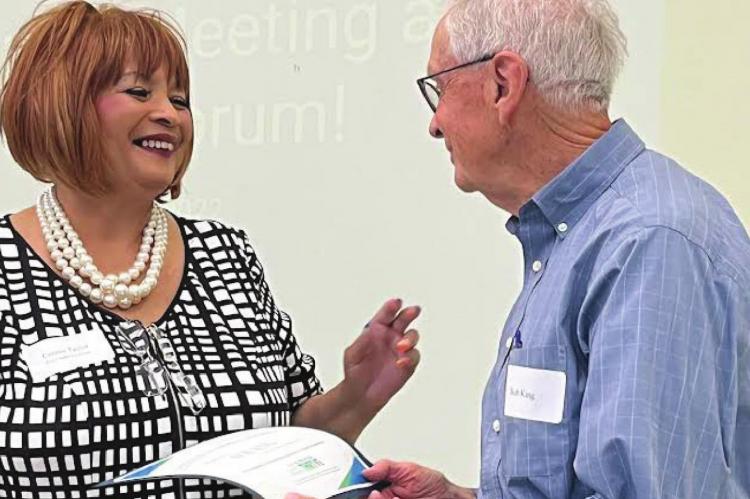 PRESIDENT CONNIE TAYLOR presents an Outstanding Service in Youth Prevention Award to Ray County Presiding Commissioner Bob King. SOPHIA BALES | Staff