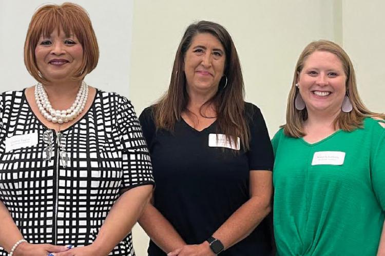 PRESIDENT CONNIE TAYLOR; Sharon Donat, president-elect; and Karen Schachtele, treasurer, are recognized during the 2022 Ray County Coalition Candidates Forum and Annual Meeting June 29. SOPHIA BALES | Staff