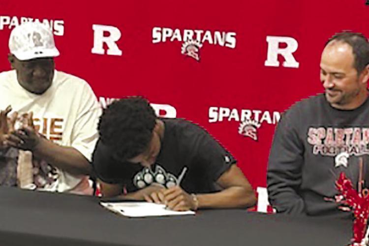 CHRISTOPHER WEBB II (center) signs with Northwest Missouri State University for sports medicine. Submitted