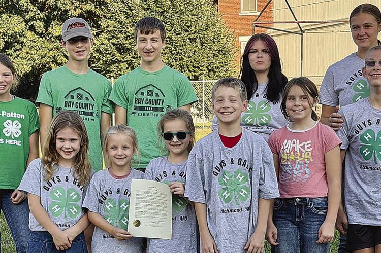 RICHMOND MAYOR MIKE WRIGHT recently recognized National 4-H Week. Celebrating the proclamation were Madison Clevenger (back row, from left), Jacob Slade, Jonah Slade, Trinity Thomas and Taylor Reeves, along with Lillian Opfer (front row, from left), Ann Covey, Alice Covey, Jack Covey, Lana Pendleton and Morgon Reeves. | Submitted