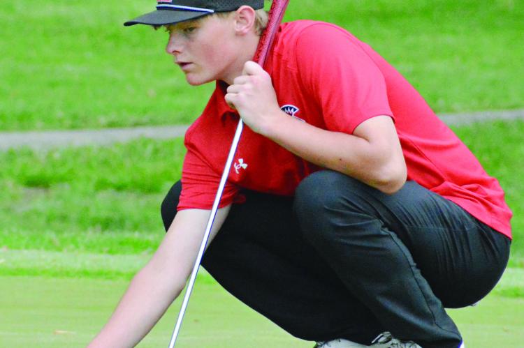 RICHMOND SOPHOMORE Isaac Kaylor marks his ball during the Class 3 District 4 Tournament. SHAWN RONEY | Staff
