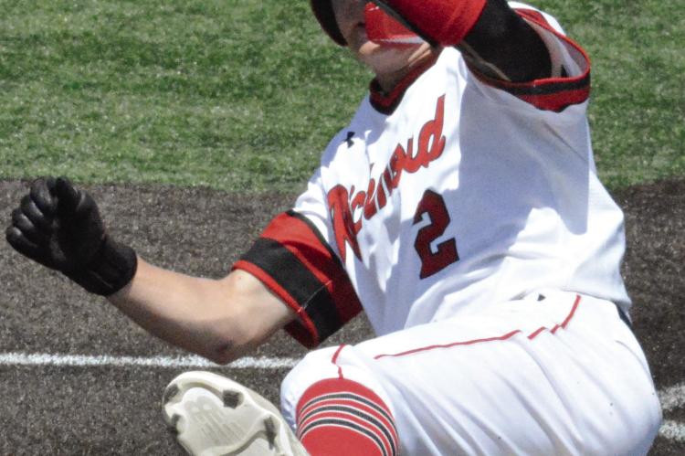 LOCHLAN STEELE slides into home plate during Richmond’s district-opening rout of Kansas City Central. Richmond then lost to Excelsior Springs in the district semifinals. SHAWN RONEY | Staff