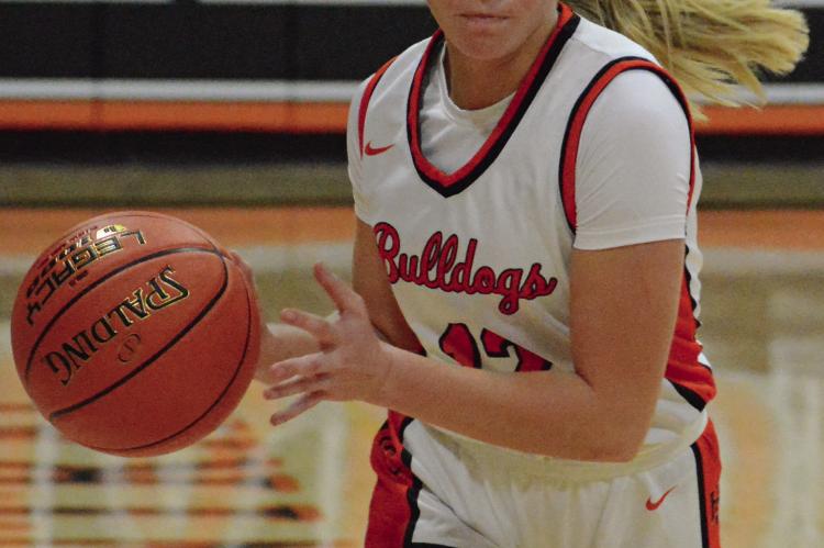 SHAWN RONEY | Staff KELSEY NOLKER controls the tempo for the Hardin-Central varsity girls during their season and home opener with Polo. Hardin-Central led the Nov. 21 basketball tilt 27-14 at halftime, but Polo came back to knot it at 38 late in the fourth quarter. The Bulldogs responded with six unanswered points down the stretch for the 44-38 victory.