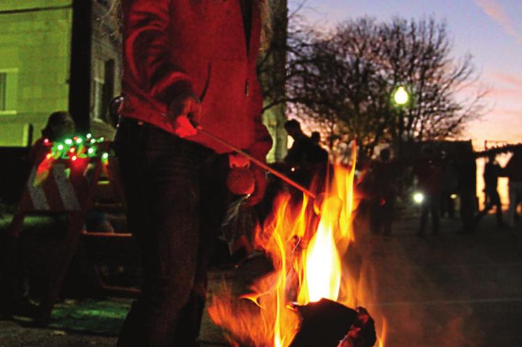 FIRST BAPTIST provides fire pits, sticks and marshmallows, and Andrea Demboski is among many people who join in the roast.