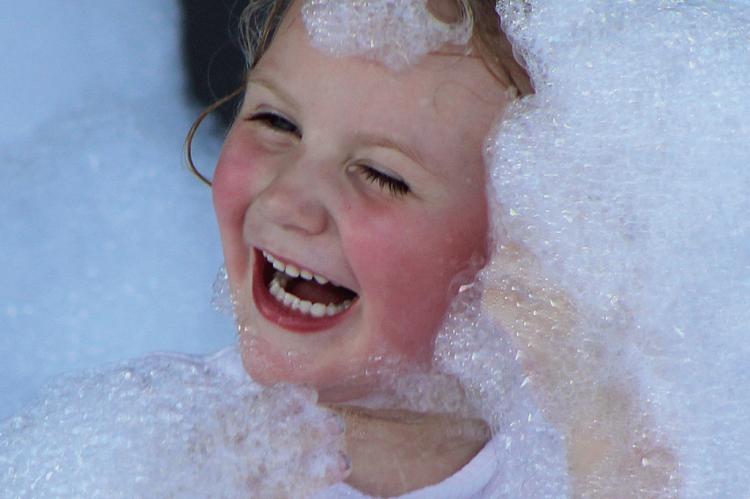 MCKINLEE NEWTON is immersed in bubble fun.