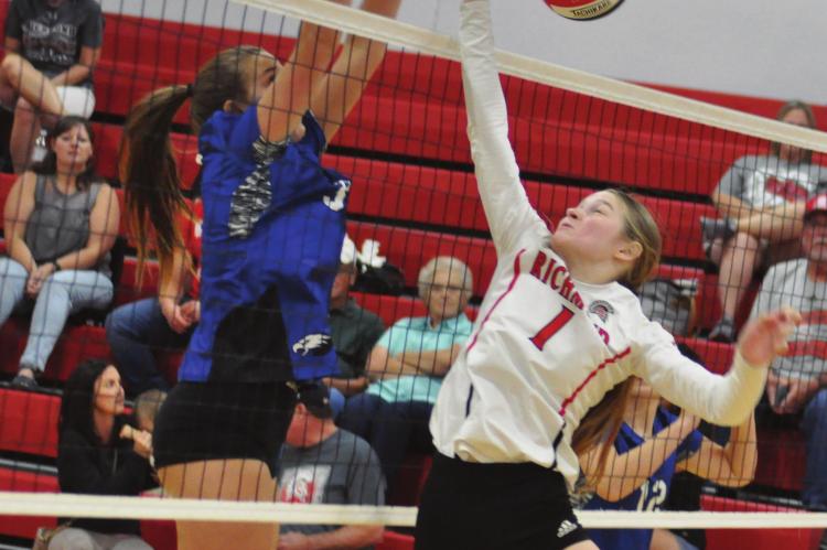KELLY JAGGARS puts up a fight at the net for Richmond during the Spartans’ season and home opener Sept. 3 against Summit Christian Academy. SHAWN RONEY | Staff
