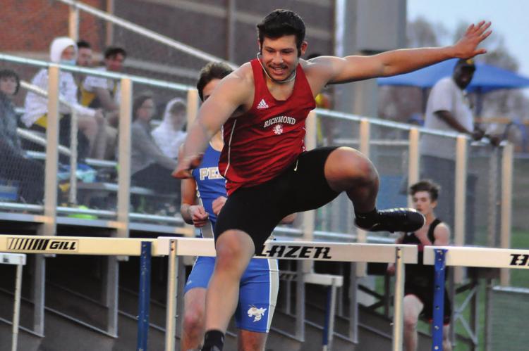RICHMOND SENOR Matthew Lopez clears another hurdle as he races to victory Tuesday at the Hoefer-Husker Invitational in Higginsville. SHAWN RONEY | Staff