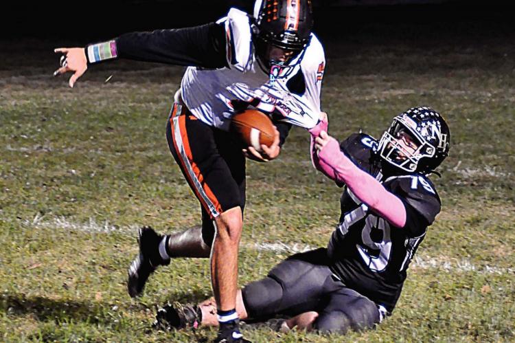 J.W. DOYLE makes a tackle for Norborne Hardin-Central to help the Aggies thump Keytesville/Northwestern of Mendon Oct. 23 at Norborne and ensure NHC will finish above .500 this season. SHAWN RONEY | Staff