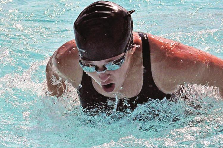 COVERING SWIMMING meets can spark one’s competitive fire. SHAWN RONEY | Staff