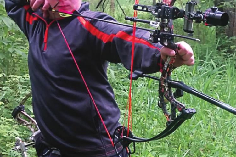 EXCELSIOR SPRINGS Middle School student Dantin McBee, 12, stands ready to hit his target.