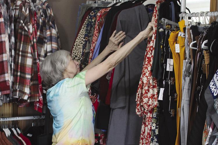 ROSA CLOYD shops for clothes at Marie’s Closet for her upcoming trip to New York.