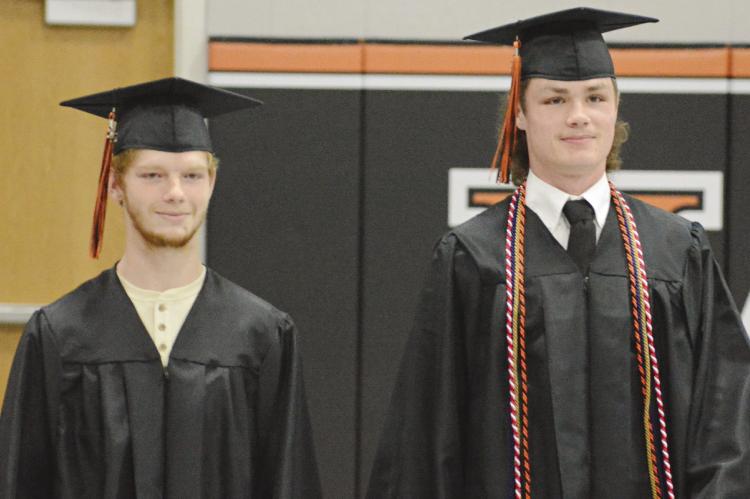 LEELIN AHRENS (left) and Kaleb Gant enter the Hardin-Central gym as the school band plays. SHAWN RONEY | Staff