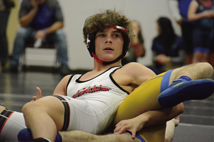 RICKY RUSS keeps his head up and the rest of his body down while maintaining control of Lafayette County’s William Ratliff during Richmond’s Jan. 25 home triangular with Lafayette County and Polo. SHAWN RONEY | Staff