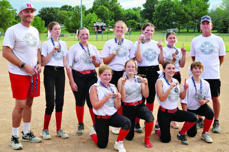 Young softballers win tourney; cap perfect season
