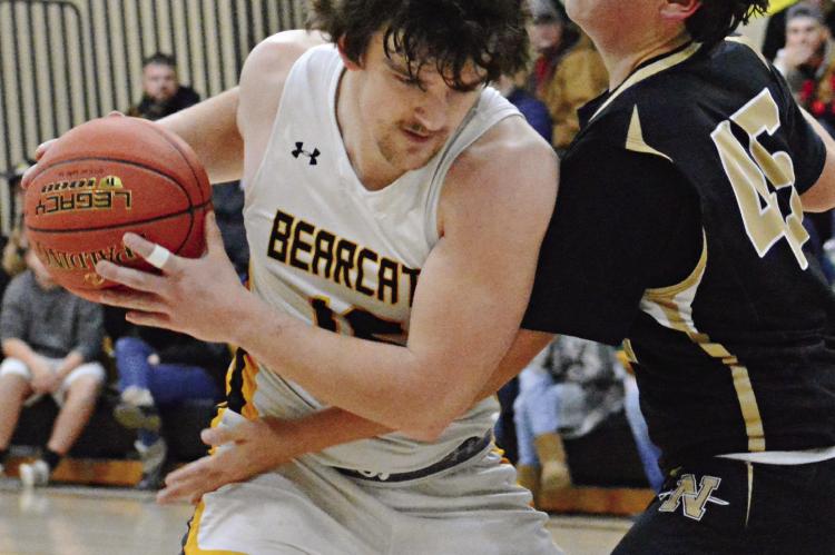 ORRICK SENIOR JAXON MILLER shields the ball from Thad Hopkins, a firstyear high schooler at Norborne, during varsity boys basketball action Jan. 5 at Orrick. SHAWN RONEY | Staff