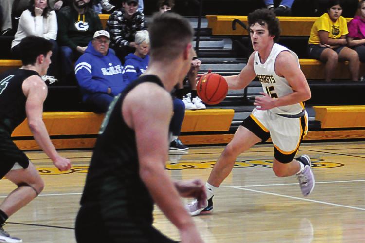 ORRICK SOPHOMORE Jaxon Miller drives against Crest Ridge’s defense during the second-quarter of the Bearcats’ 32-point loss Dec. 4 at Orrick to open the I-70 Conference Tournament. SHAWN RONEY | Staff
