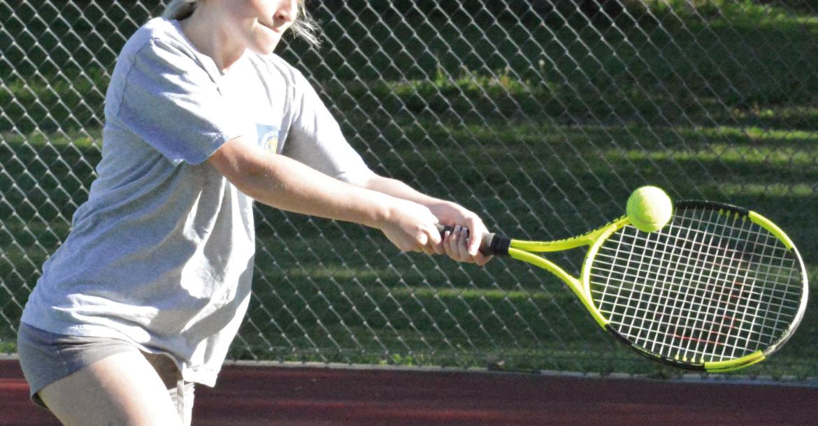 CARSYN TEAT works on her two-fisted backhand during a training session for Richmond High School girls. SHAWN RONEY | Staff