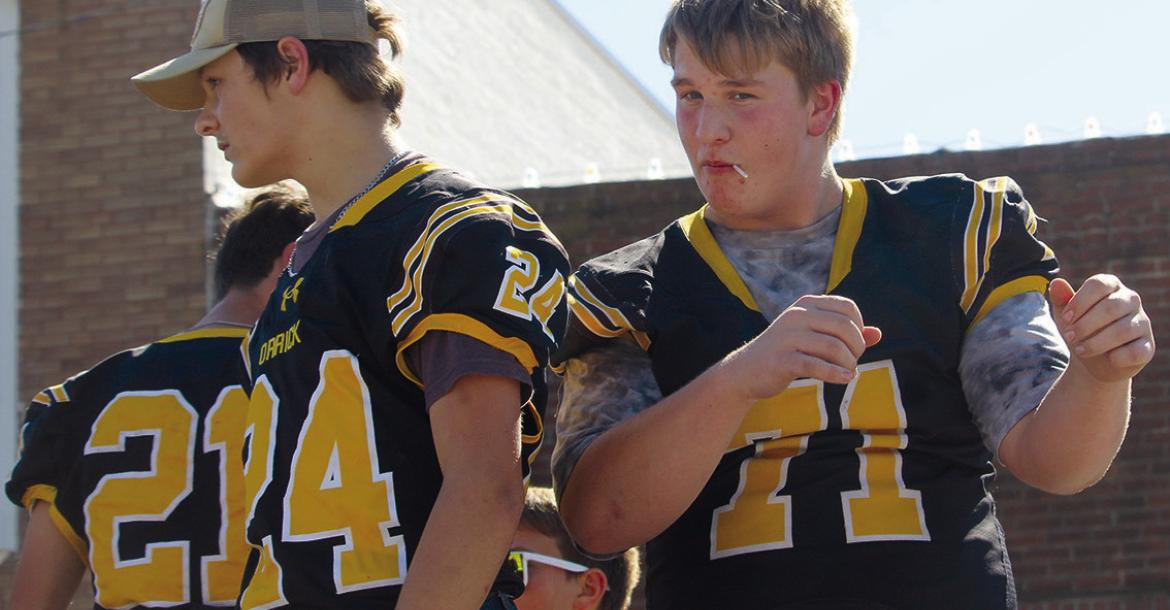ORRICK BEARCAT FOOTBALLERS dance their way down the parade route during homecoming festivities. MIRANDA JAMISON | Staff