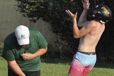 ORRICK ASSISTANT COACH Jake Waters (left) ducks as Gage Tebbe hauls in a deep ball during team camp for varsity 8-man football. SHAWN RONEY | Staff