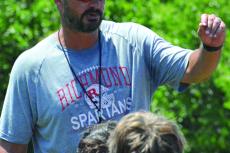 RICHMOND FOOTBALL COACH Nick Persell talks to his players to cap a team camp session. SHAWN RONEY | Staff