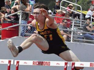 JONATHON HARRIS, shown running the hurdles in 2023 in Richmond, is the first state champion during Kirk Thacker’s tenure as a varsity track coach. SHAWN RONEY | Staff