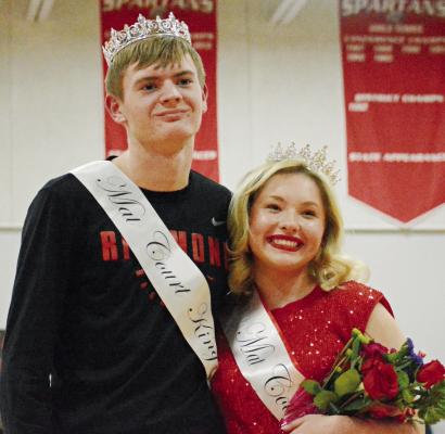 HUNTER MITCHELL and Livia Cavanah sport their crowns and sashes after being after being named mat court king and queen, between Richmond High School varsity basketball games. SHAWN RONEY | Staff
