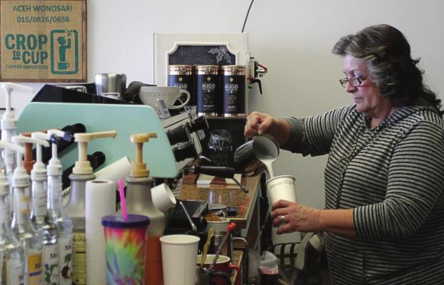 SERENDIPITY co-owner Kathy Fitzwater works to create chai latte, a blend that includes black tea and milk, which originated centuries ago in India.