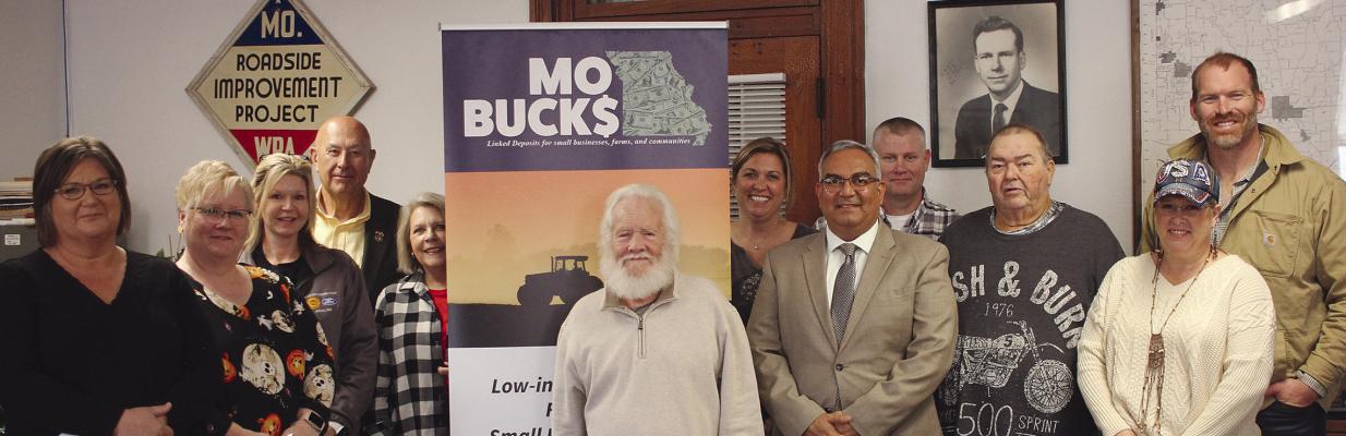 COUNTY LEADERS and state representatives discuss the MOBUCK$ program. SOPHIA BALES | Staff