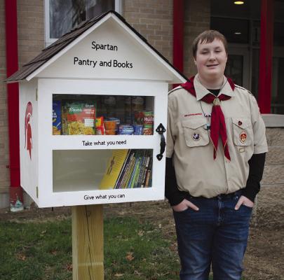 KALVIN SPRATT, 15, created the “Spartan Pantry and Books” as his Eagle Scout project. SOPHIA BALES | Staff